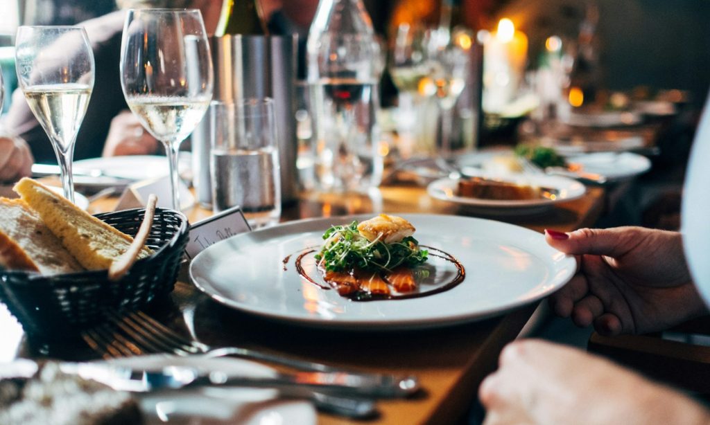 Food on a white plate in a restaurant